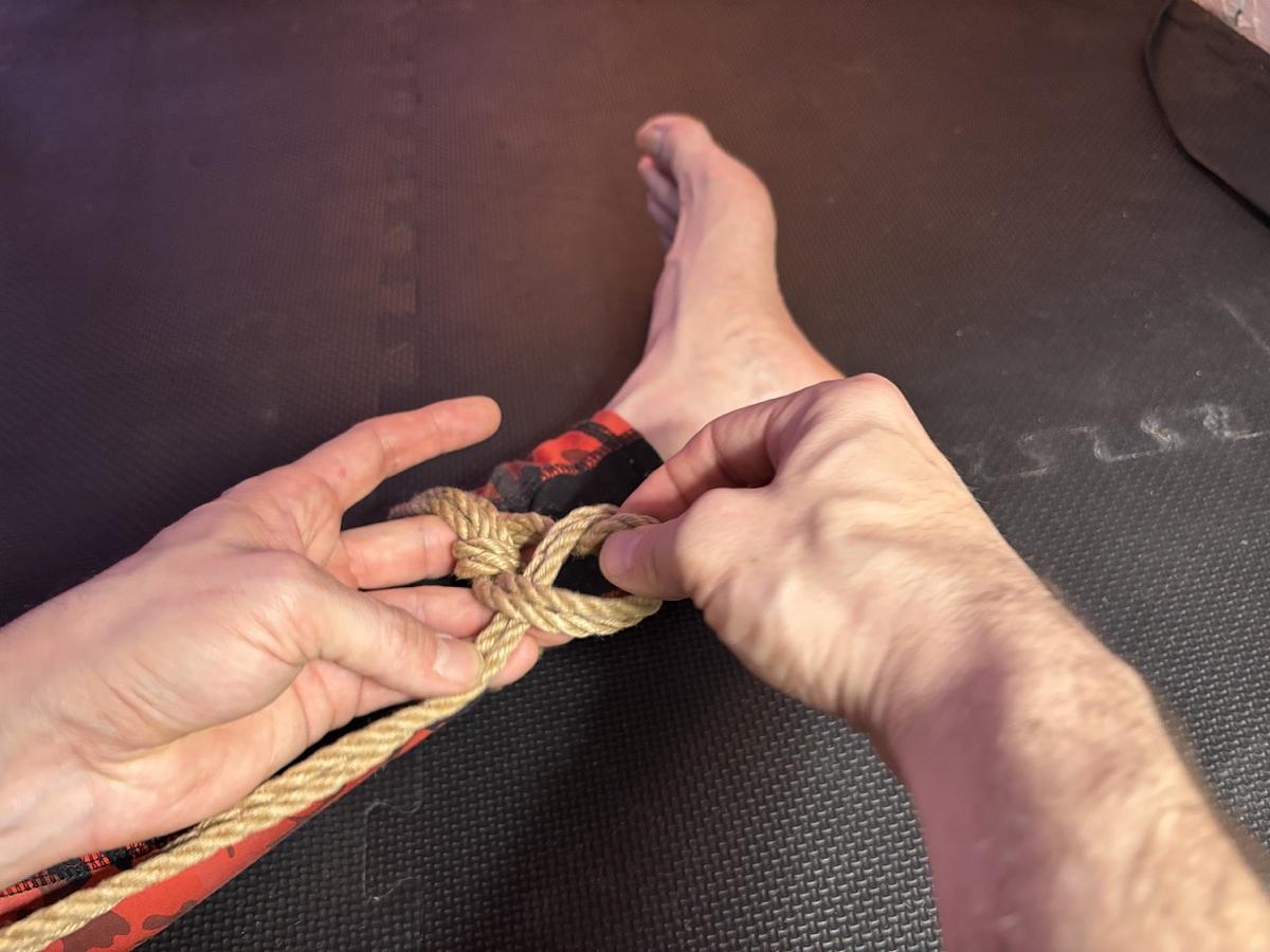 The running end goes under the loop — CORRECT