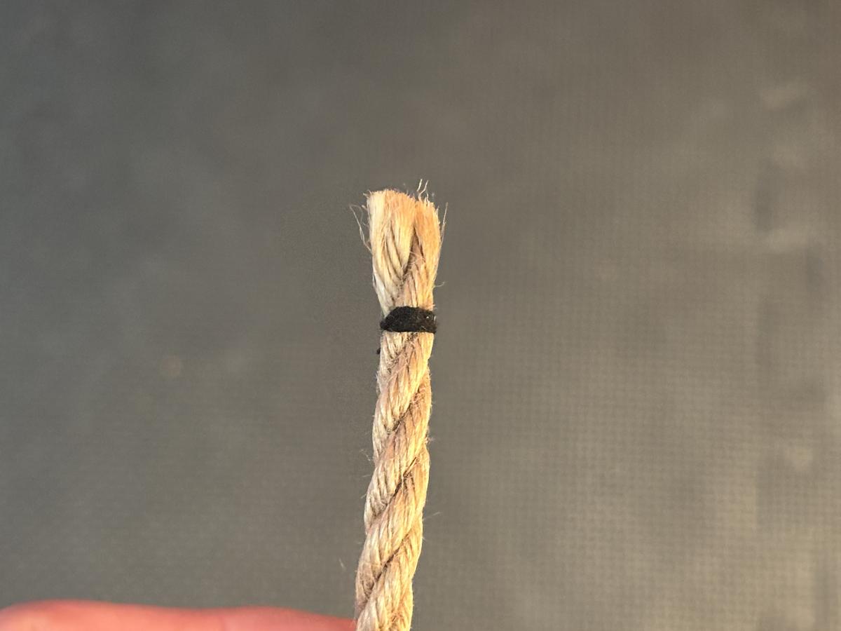 Whipped end (natural fiber rope with a black whipping)